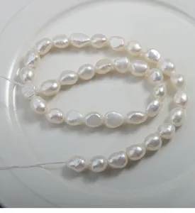 Natural freshwater baroque pearl strand 9mm white pearls smooth surface jewelry detail.