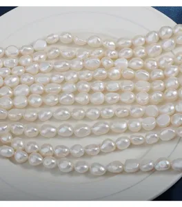 Close-up of natural freshwater baroque pearls showing beautiful luster and unique texture details.