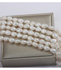 Detail shot of 9mm baroque freshwater pearl strand, natural seedless pearls with double-sided luster.