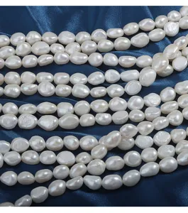 Detail shot of natural freshwater baroque pearl strands, irregular shape, glossy finish.