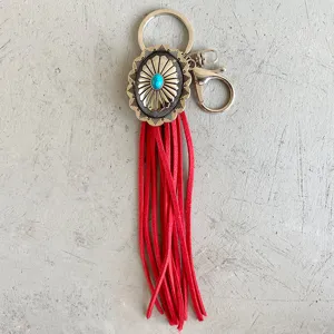 Vintage Western style leather fringe keychain with turquoise concho pendant for keys.