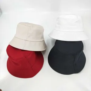 Detailed view of casual cotton bucket hats in multiple colors, featuring a classic plain design.