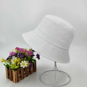 White cotton bucket hat detail, classic plain design for sun protection and outdoor daily wear.