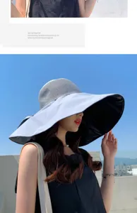 Detailed view of the wide-brim sun hat showing breathable mesh crown and black UV protection lining.