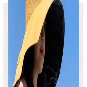 Women large brim sun hat detail view, stylish yellow anti-UV cap for summer outdoor activities.