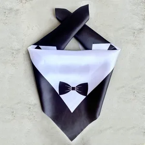 Close-up detail of a pet wedding tuxedo bandana with a black bow tie for dogs and cats.