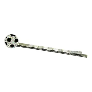 Close-up detail shot of the sparkly soccer ball decorative hair clip, metallic bobby pin.