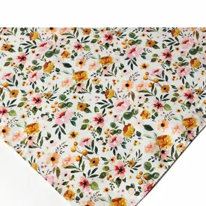 Floral pet bib detail close-up showing vibrant vintage watercolor flower print design.