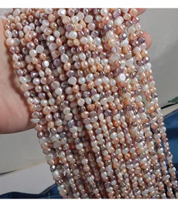 Close-up detail of colorful baroque freshwater pearl strands, natural shiny pearl texture.