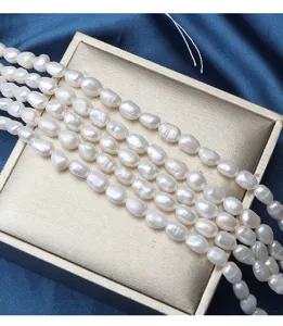 Detail view of 6-7mm baroque freshwater pearls strand, irregular natural white pearl luster.