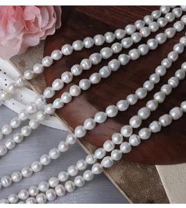 Detail shot of 7mm baroque freshwater pearls, irregular loose beads for DIY handmade jewelry crafting.