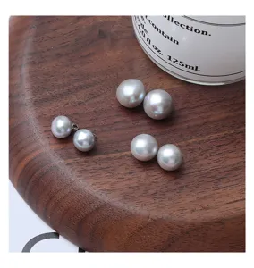 Gray freshwater pearl buttons, delicate clothing DIY accessories, detail close-up shot.