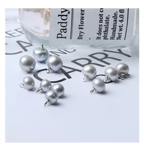 Detailed view of grey freshwater pearl button diy accessory for clothing and garments.