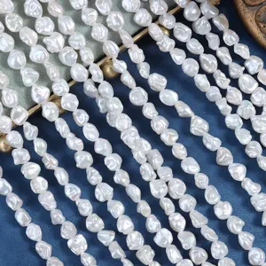 Detail shot of white baroque freshwater pearls strands, showing unique shape and bright luster.
