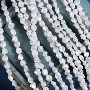 Close-up detail of natural freshwater baroque pearls in irregular shapes with lustrous pearl finish.