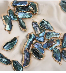 Colorful baroque freshwater pearl pendants with metallic edges, ideal for DIY jewelry making.
