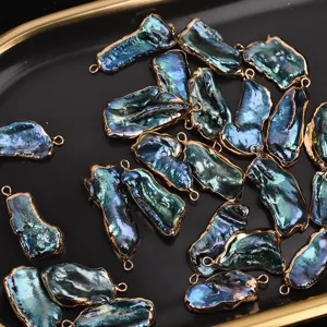 Colorful baroque pearl pendants with gold-plated edges, perfect for DIY jewelry making.