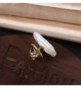 Baroque pearl brooch detail shot, showing the irregular freshwater pearl and gold pin back.