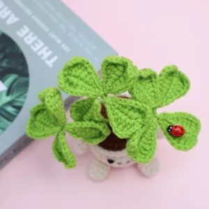 Handmade crochet four leaf clover potted plant, cute desktop ornament with a tiny ladybug.