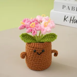 Handcrafted crochet potted flower detail view, cute knitted plant ornament for desktop decor.