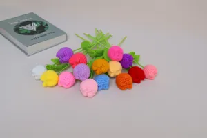 Detailed close-up shot of colorful handmade crochet wool tulips, multi-color flower decor.