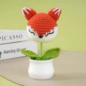 Handgemaakte gehaakte vos bloem potplant detail, schattig wollen decoratie ornament.