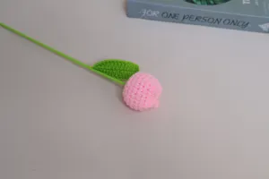 Handcrafted crochet pink tulip flower detail, cute handmade yarn floral home decor accent.
