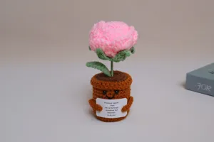 Crochet emotional support potted plant detail, handmade pink flower with cute face pot.