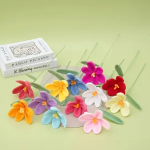 Handmade crochet yarn flowers detail shot, colorful knitted floral decor for gifts.