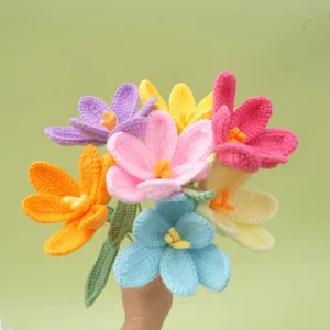 Handmade crochet flower detail showing colorful woven bouquet petals and green stem texture clearly.