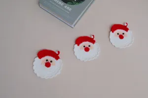 Handmade crochet Santa Claus coasters set, cute winter holiday table decor knit mats.