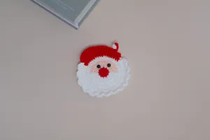 Handmade crochet Santa Claus coaster, cute Christmas wool knit cup table mat detail display.