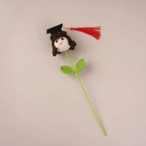 Handmade crochet graduation doll flower gift, cute cartoon plush toy with mortarboard hat.