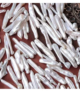 Detailed view of natural baroque long freshwater pearl loose beads, ideal for DIY jewelry making.