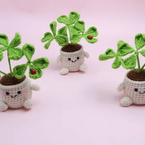 Handcrafted crochet four-leaf clover potted plant, cute desktop ornament for lucky decor.