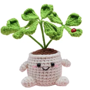 Cute crochet potted clover plant handmade wool desktop ornament with smiling face pot.