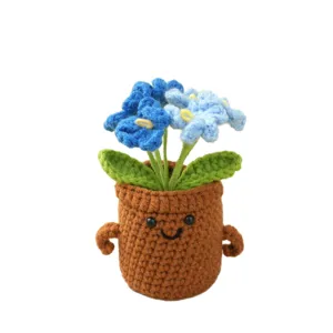 Handcrafted crochet blue forget-me-not potted plant cute smiling desk ornament gift.