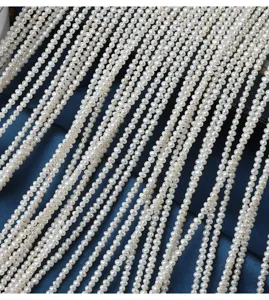 Detail view of natural freshwater pearl strands, 2.5-3mm small potato pearls, 38cm length.