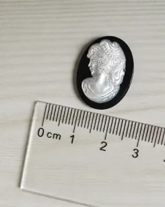 Natural mother of pearl shell cameo lady portrait pendant DIY fashion accessory detail.
