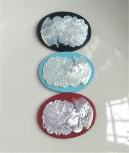 Natural mother-of-pearl carved cameo pendant detail, exquisite shell art DIY jewelry accessory.