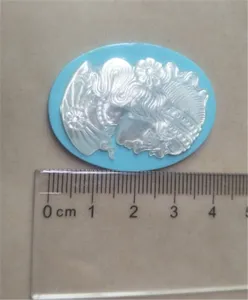 Natural mother of pearl cameo carved portrait shell pendant jewelry DIY craft accessory detail.