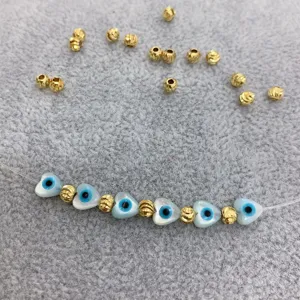 DIY handmade jewelry accessories, 4mm textured gold beads and blue evil eye heart beads.