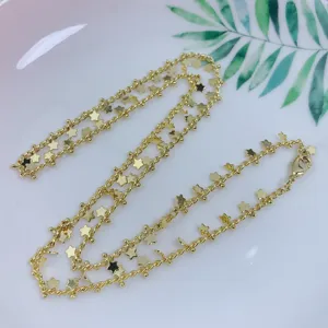 Gold star beaded chain necklace, minimalist clavicle chain accessory for trendy women detail.