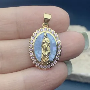 Exquisite oval Guadalupe Virgin Mary pendant featuring pink zircon and pearl shell.