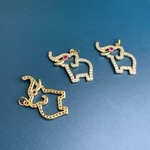 Gold-toned rhinestone elephant pendant detail shot, sparkling crystal DIY jewelry accessory.