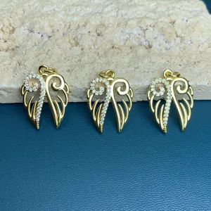 Gold rhinestone wing charm detail closeup for DIY necklace and earring accessories