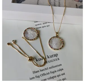 Gold-plated mother of pearl necklace bracelet set with colorful cubic zirconia stones pendant.