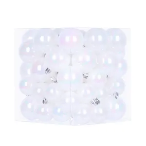 Transparent iridescent Christmas tree baubles set in a clear box for party home decoration.