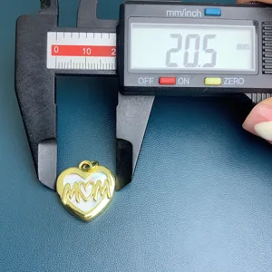 Detail view of the gold heart MOM pendant with white insert, measured at 20.5mm for stylish jewelry.