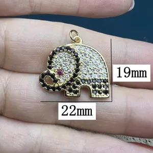 Gold elephant pendant detail showing precise dimensions of 19mm by 22mm with cubic zirconia.